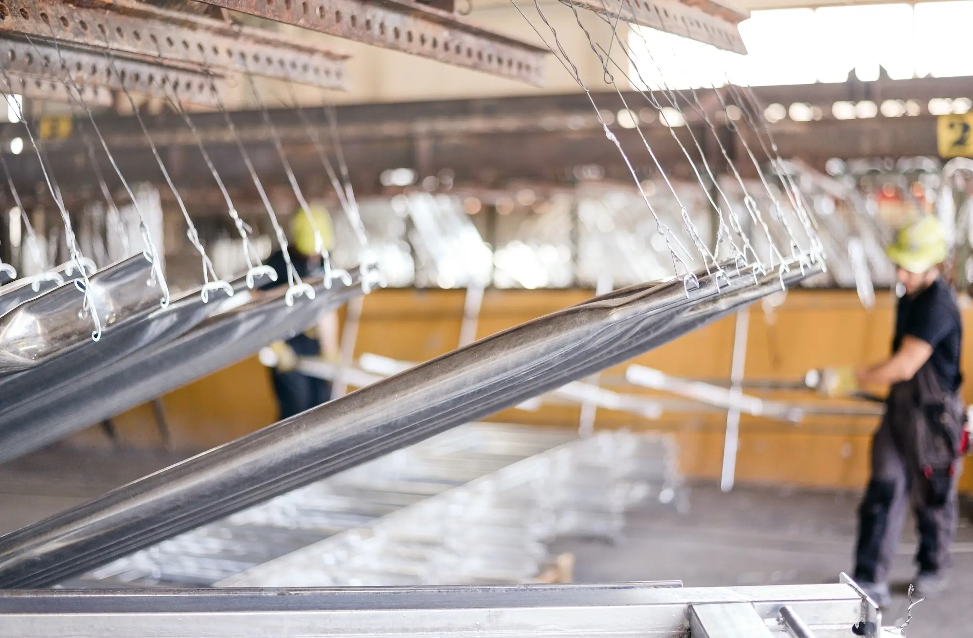 Movement of metal parts on the passivation line conveyor in the factory.