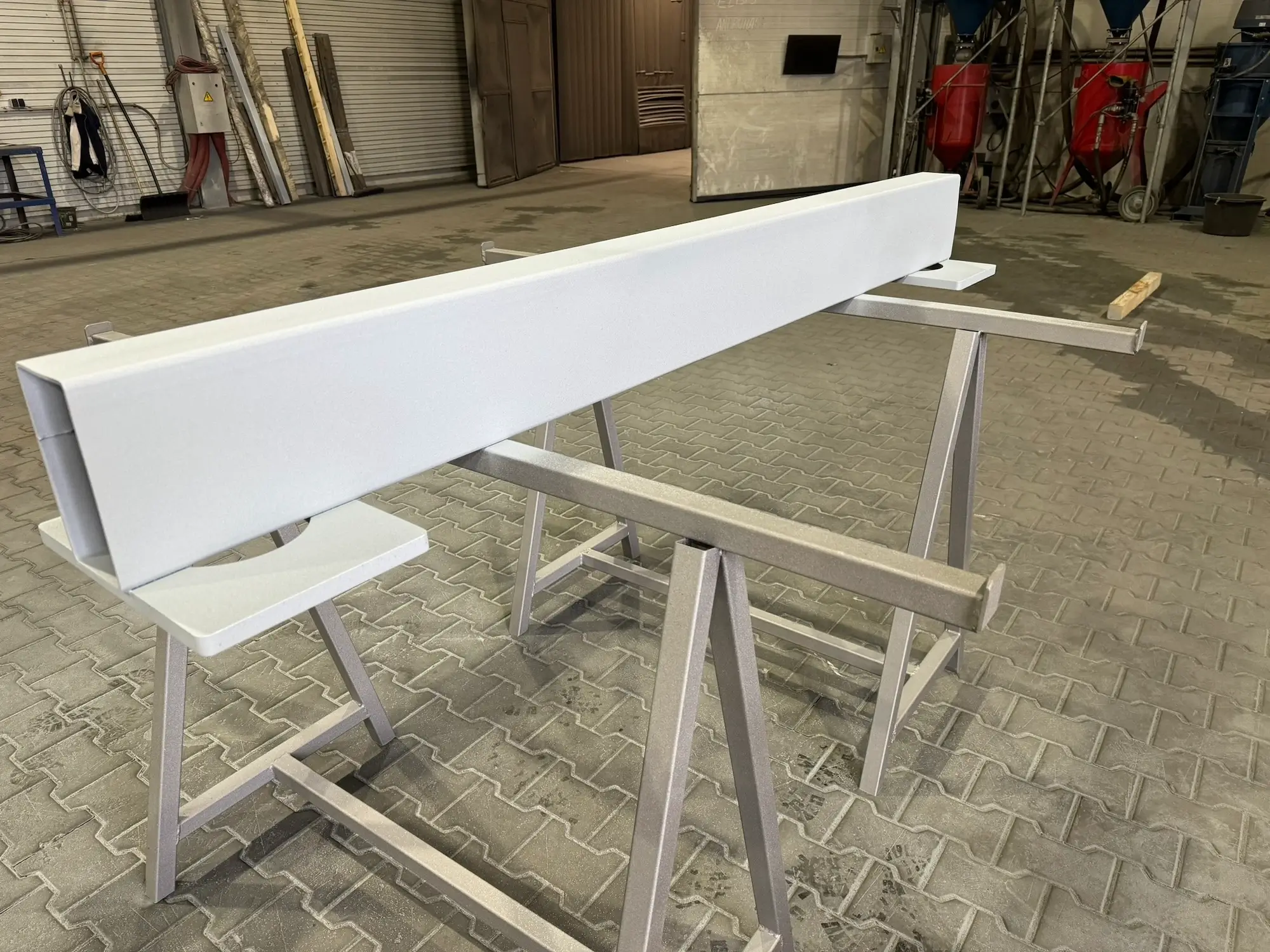 Finished metallized metal structure on trestles in the factory, ready for transport.