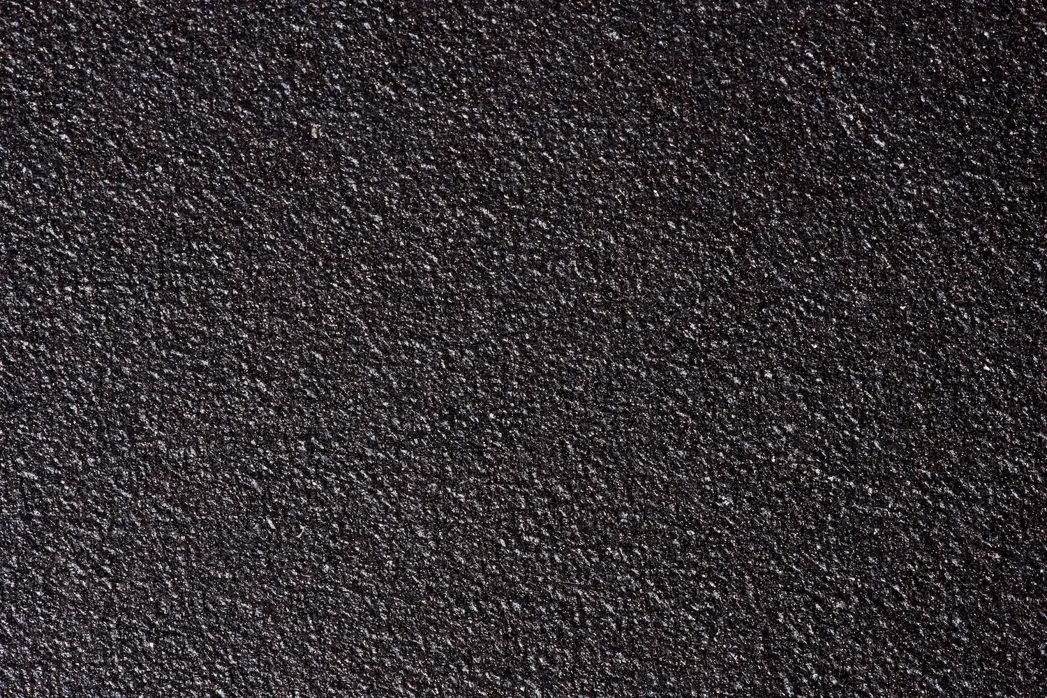 Rough structure of metallized steel surface close-up, forming a strong protective layer.