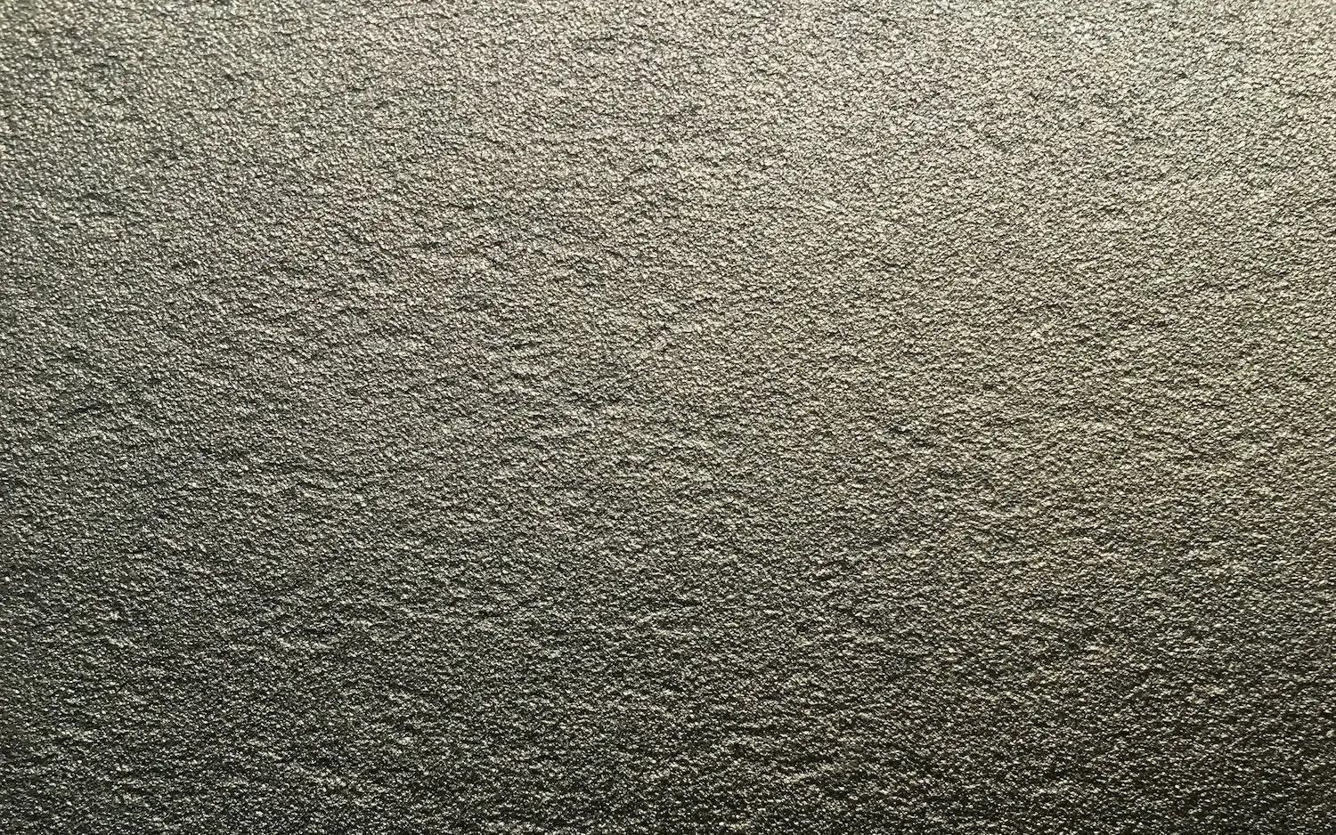 Matte texture of thermally sprayed zinc coating (metallization), protecting against corrosion.